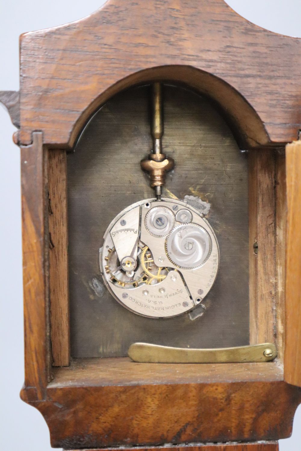 A mahogany and burr walnut miniature longcase clock, with Elgin watch movement, height 46cm